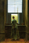 A woman leans out of the window