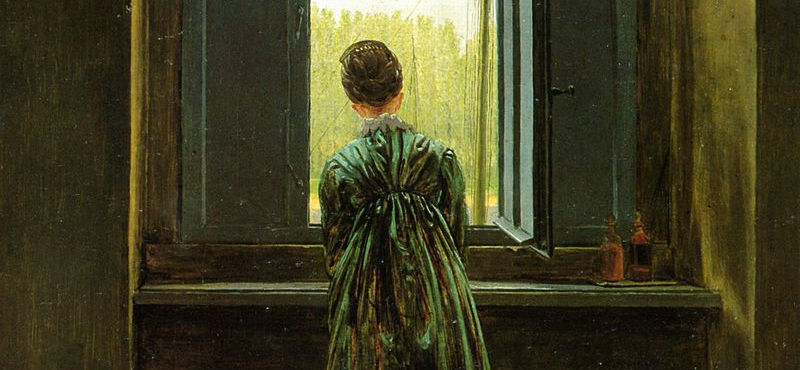 A woman leans out of the window
